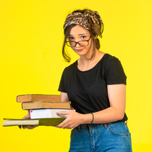 young schoolgirl eyeglasses holding her books her glasses121